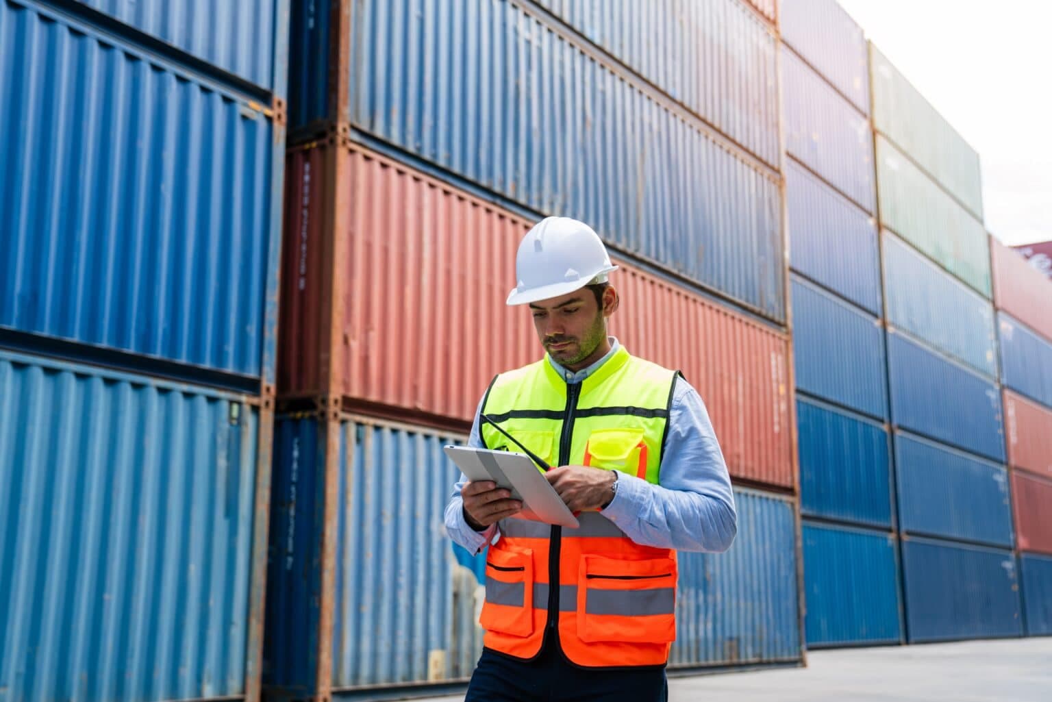 Male,Industrial,Engineer,In,White,Hard,Hat,Using,Digital,Tablet